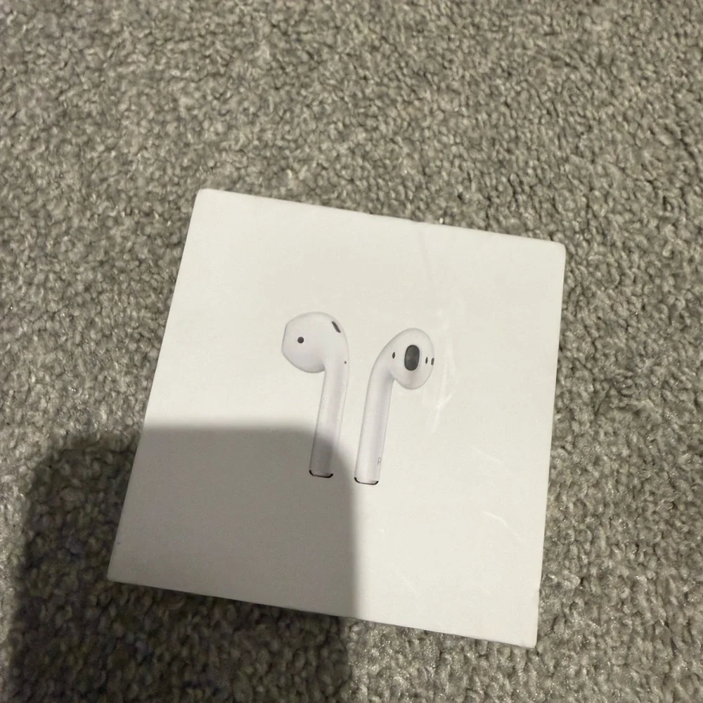 Apple AirPods with charging case Wireless Earbuds - White